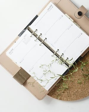 white and browm notebook